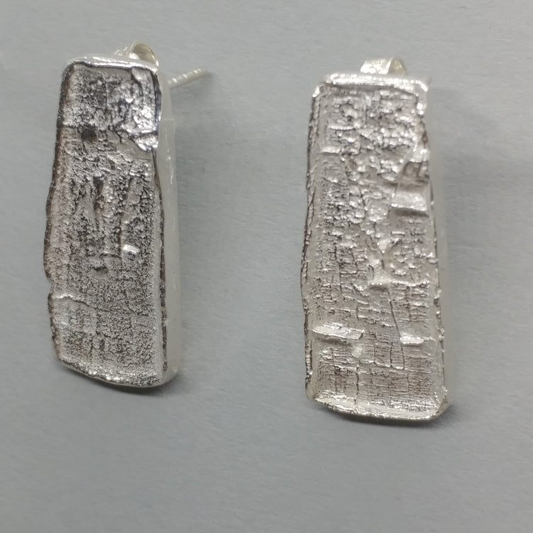 Pair of textured rectangular silver stud earrings