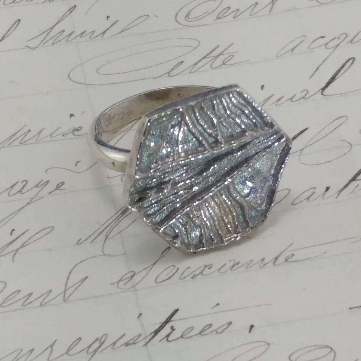 Silver ring with a textured octagonal top