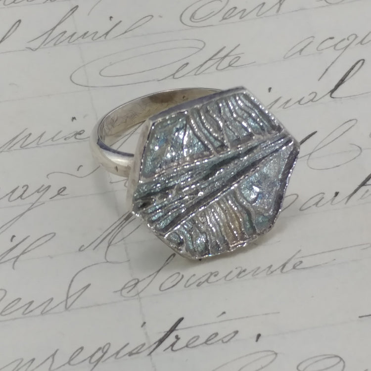 Silver ring with a textured octagonal top