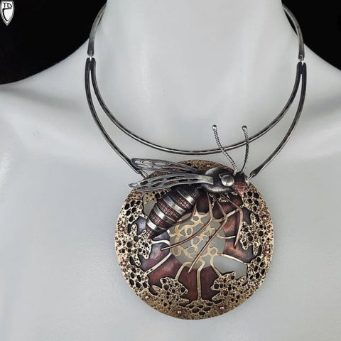 Decorative necklace with intricate design on a mannequin
